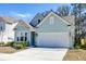 Charming home exterior with a two-car garage and well-manicured landscaping at 2317 Chisol Plow St, Mount Pleasant, SC 29466