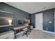 Dark walled Home office with desk, computer, and a large window for ample light at 2317 Chisol Plow St, Mount Pleasant, SC 29466