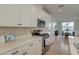 Well-lit kitchen featuring white countertops and cabinetry and stainless steel appliances at 2317 Chisol Plow St, Mount Pleasant, SC 29466
