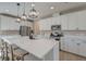 This contemporary kitchen is equipped with stainless steel appliances, sleek white cabinets, and a central island at 2317 Chisol Plow St, Mount Pleasant, SC 29466