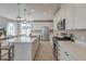 Modern kitchen with white cabinets, stainless steel appliances, and a spacious island with seating at 2317 Chisol Plow St, Mount Pleasant, SC 29466