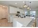 Open concept kitchen with a large central island, pendant lighting, and stainless steel appliances at 2317 Chisol Plow St, Mount Pleasant, SC 29466