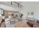 Light-filled open layout with modern decor, a soaring mezzanine, and a seamless transition to the dining and kitchen area at 2317 Chisol Plow St, Mount Pleasant, SC 29466