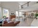 Bright, open-concept living space with soaring ceilings, modern furnishings, and seamless flow to the kitchen at 2317 Chisol Plow St, Mount Pleasant, SC 29466
