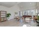 Bright living room with light wood floors, neutral furniture, and ample natural light from large windows at 2317 Chisol Plow St, Mount Pleasant, SC 29466
