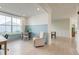 Bright and airy office space with light wood flooring, large window, and modern chair and desk at 2317 Chisol Plow St, Mount Pleasant, SC 29466