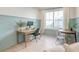 Bright office space featuring a large window, comfortable seating, and stylish decor for a productive work environment at 2317 Chisol Plow St, Mount Pleasant, SC 29466