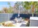 Inviting backyard patio with outdoor seating, lush greenery, and privacy fencing at 2416 Kings Gate Ln # 403, Mount Pleasant, SC 29466