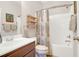 Functional bathroom with a single sink vanity, toilet, and a shower-tub combination with a decorative shower curtain at 2416 Kings Gate Ln # 403, Mount Pleasant, SC 29466