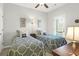 Inviting bedroom with two twin beds, ceiling fan, and a door leading to a balcony or outdoor area at 2416 Kings Gate Ln # 403, Mount Pleasant, SC 29466