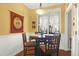 Cozy breakfast nook featuring a round table, wooden chairs, and natural light from a window with plantation shutters at 2416 Kings Gate Ln # 403, Mount Pleasant, SC 29466