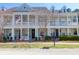 Charming townhomes with covered front porches, decorative columns, and well-maintained landscaping at 2416 Kings Gate Ln # 403, Mount Pleasant, SC 29466