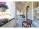 Covered front porch with a seating area, lantern, and view of the neighborhood at 2416 Kings Gate Ln # 403, Mount Pleasant, SC 29466