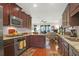 Modern kitchen with stainless steel appliances, wood cabinets, and hardwood flooring at 2416 Kings Gate Ln # 403, Mount Pleasant, SC 29466