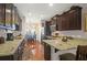 Stylish kitchen with dark cabinets, granite countertops, and stainless steel appliances at 2416 Kings Gate Ln # 403, Mount Pleasant, SC 29466