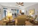 Inviting living room with ample seating, natural light, and hardwood floors at 2416 Kings Gate Ln # 403, Mount Pleasant, SC 29466