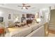 Comfortable living room featuring a ceiling fan, wood floors, and an open concept leading to the kitchen at 2416 Kings Gate Ln # 403, Mount Pleasant, SC 29466