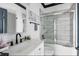 Bright bathroom featuring a tub shower, white vanity, and modern fixtures at 263 St Philip St, Charleston, SC 29403