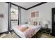 Stylish bedroom featuring modern decor, a comfortable bed with designer bedding, and bright natural light at 263 St Philip St, Charleston, SC 29403