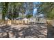 Fenced backyard with bare ground and limited landscaping provides a secure and open space at 2714 W Surrey Dr, North Charleston, SC 29405
