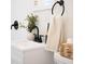 Modern bathroom sink with black faucet and matte black hardware against white tile walls at 2714 W Surrey Dr, North Charleston, SC 29405