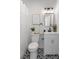 Modern bathroom featuring black and white patterned floors and a decorative mirror at 2714 W Surrey Dr, North Charleston, SC 29405