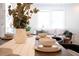 Cozy dining area with hardwood floors, stylish decor and soft, natural lighting at 2714 W Surrey Dr, North Charleston, SC 29405