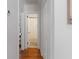 Hallway featuring hardwood floors and access to a bathroom and other rooms in the home at 2714 W Surrey Dr, North Charleston, SC 29405