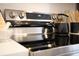 Close up on stainless steel kitchen stove with black tea kettle on smooth cooktop at 2714 W Surrey Dr, North Charleston, SC 29405