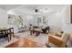 Bright living room with hardwood floors, neutral decor and ceiling fan at 2714 W Surrey Dr, North Charleston, SC 29405