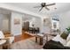 Open concept living and dining area with hardwood floors and plenty of natural light at 2714 W Surrey Dr, North Charleston, SC 29405