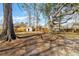 Spacious backyard featuring large trees, a shed, and plenty of room to enjoy at 28 Elmora Ave, Goose Creek, SC 29445