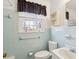 Bathroom with a window, a toilet, and a sink at 28 Elmora Ave, Goose Creek, SC 29445