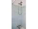 Bathroom shower featuring light blue tiles and vintage fixtures at 28 Elmora Ave, Goose Creek, SC 29445