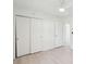 Neutral bedroom featuring pale floors, a ceiling fan, and a large closet at 28 Elmora Ave, Goose Creek, SC 29445