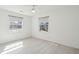 Sunlit bedroom with two windows, pale flooring, and neutral wall color at 28 Elmora Ave, Goose Creek, SC 29445
