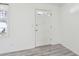Clean entryway featuring neutral walls, modern gray floors, white door, and natural light at 28 Elmora Ave, Goose Creek, SC 29445