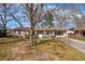 Charming brick home with a well-maintained front yard and mature trees providing shade at 28 Elmora Ave, Goose Creek, SC 29445
