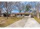 Beautiful single-story home featuring a long driveway, brick facade, and well-kept landscaping at 28 Elmora Ave, Goose Creek, SC 29445