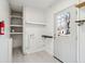 Utility room featuring washer hookups, shelves, and back door to yard at 28 Elmora Ave, Goose Creek, SC 29445