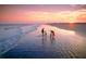Gathering enjoying the beach at sunset, creating lasting memories in a serene coastal setting at 2837 Baywood Dr, Seabrook Island, SC 29455