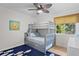 bedroom with bunk beds, a window with a view of the trees, and hardwood floors at 2837 Baywood Dr, Seabrook Island, SC 29455