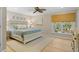 Bedroom featuring a white bed, hardwood floors, soft colors, and a window with a view of the outdoors at 2837 Baywood Dr, Seabrook Island, SC 29455