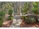 Inviting outdoor space featuring a stone pathway and wooden deck with cozy seating at 2837 Baywood Dr, Seabrook Island, SC 29455