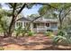 Inviting exterior of home with deck and mature trees, perfect for relaxation and privacy at 2837 Baywood Dr, Seabrook Island, SC 29455