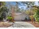 Home exterior features lush landscaping, a covered front porch, and a paved driveway at 2837 Baywood Dr, Seabrook Island, SC 29455