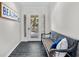 Bright foyer featuring tile floors, a wooden bench, and a welcoming 'Beach' sign at 2837 Baywood Dr, Seabrook Island, SC 29455