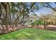 View of a lovely home surrounded by mature trees and a beautifully maintained lawn at 2837 Baywood Dr, Seabrook Island, SC 29455