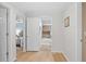 Hallway view leading to bedroom and bathroom with hardwood floors and neutral paint at 2837 Baywood Dr, Seabrook Island, SC 29455