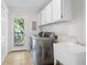 Convenient laundry room with stainless steel appliances, ample storage, and a utility sink at 2837 Baywood Dr, Seabrook Island, SC 29455